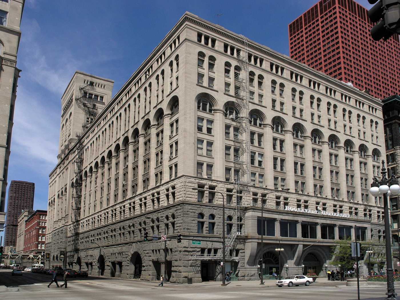 Exterior of grey stone building on city street corner