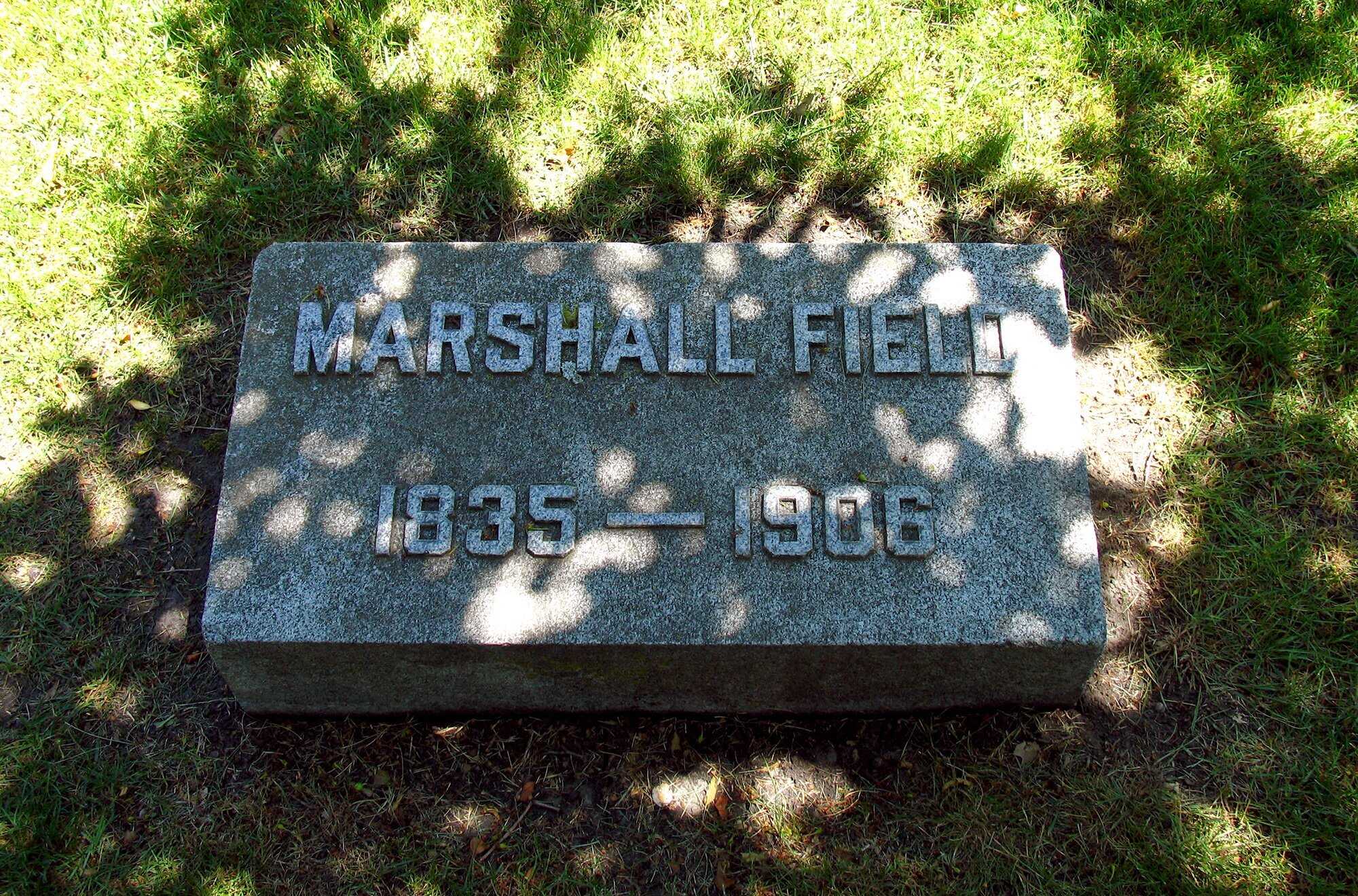 Flat memorial plaque on green grass