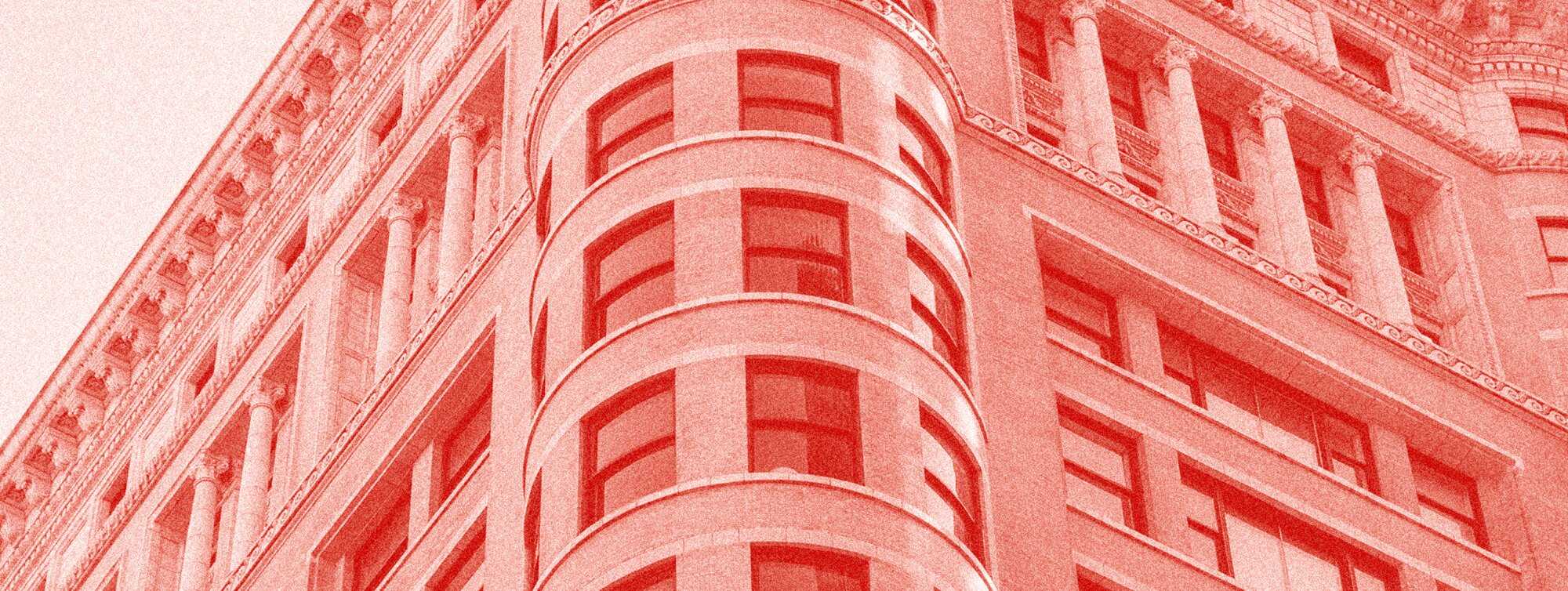 a red overlayed photo building windows