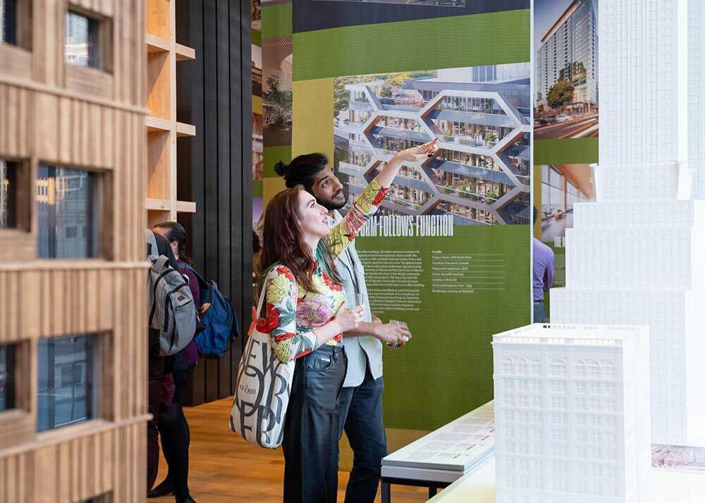 A young couple looking at an exhibit intently