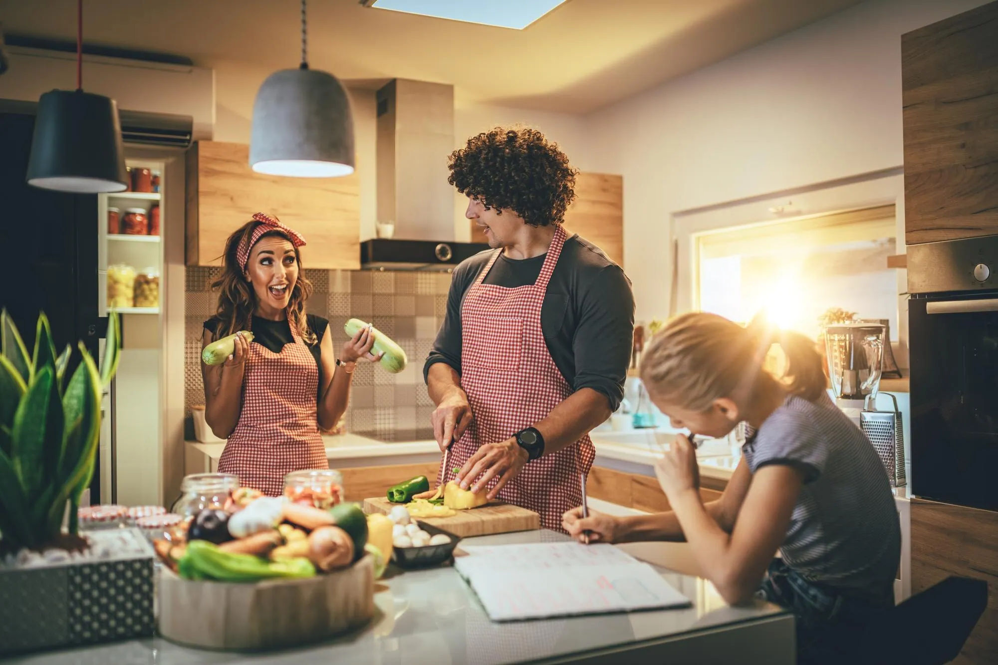 Family cooking a planned dinner together after the weekly decisions are made