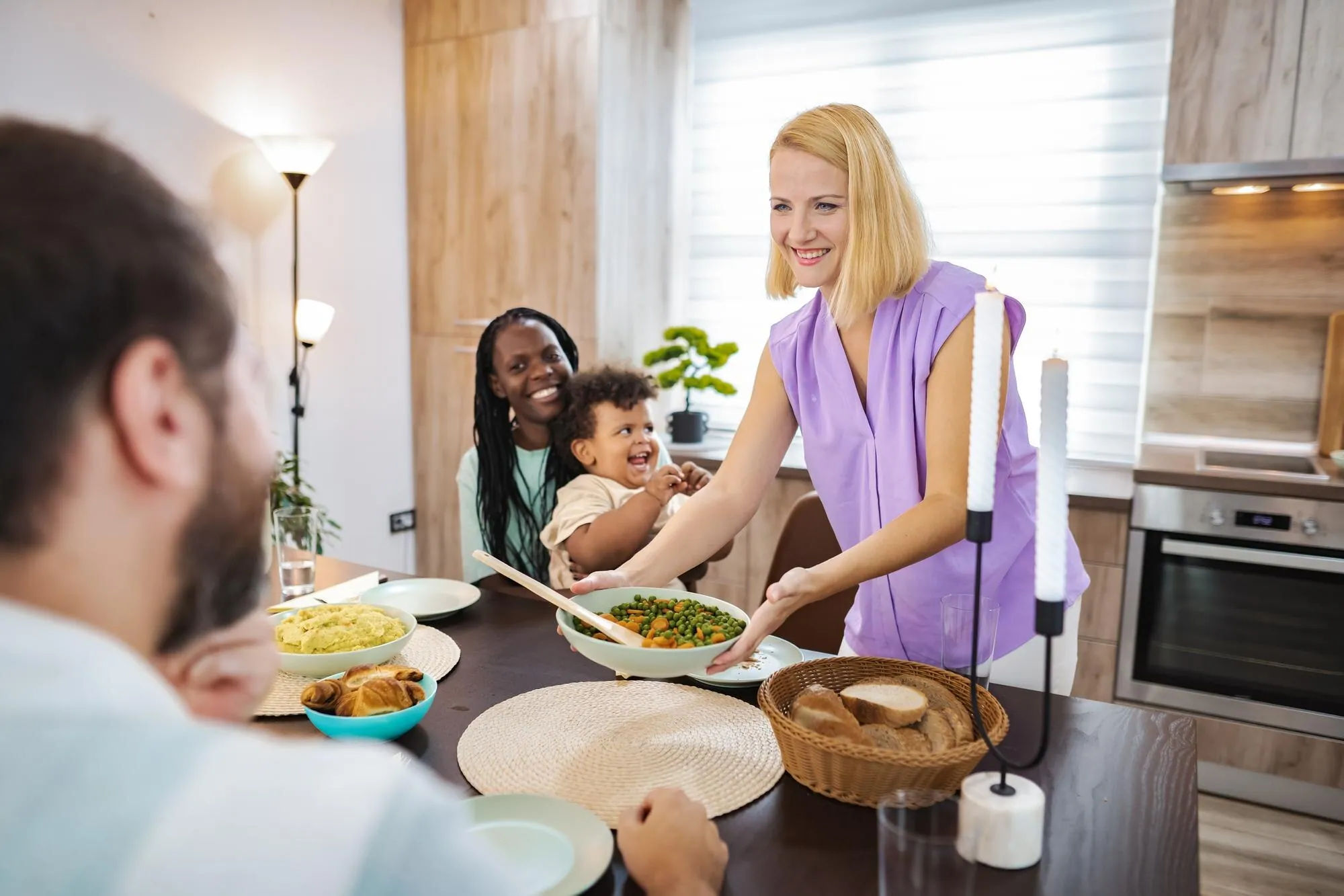 Family sharing a flexible dinner with dishes served separately