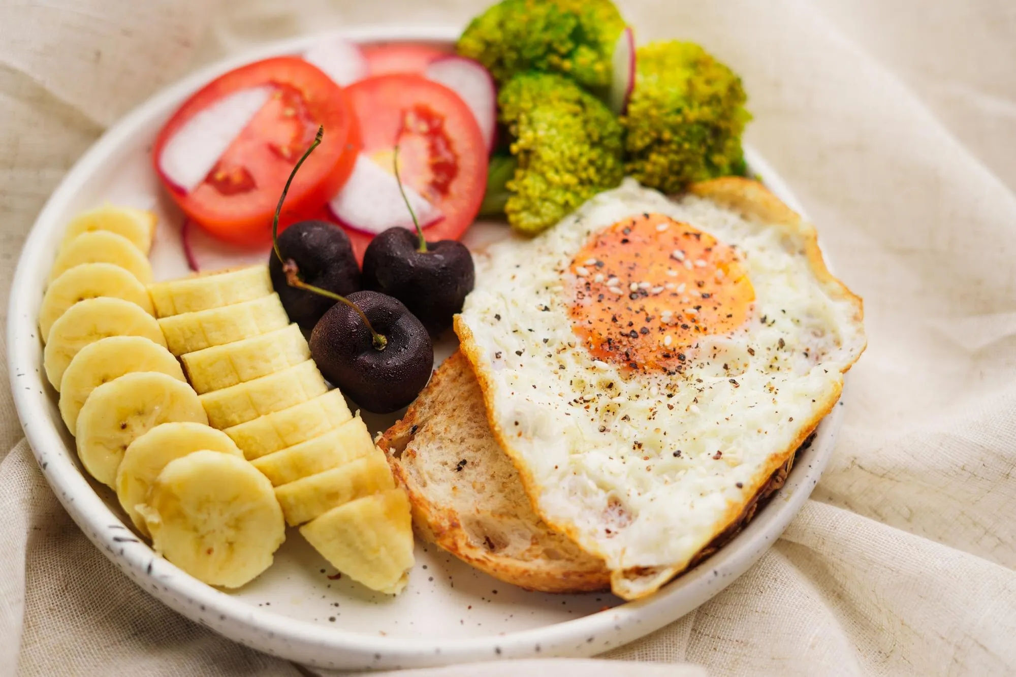 Savory egg toast with fruit and vegetables as a fast hot breakfast