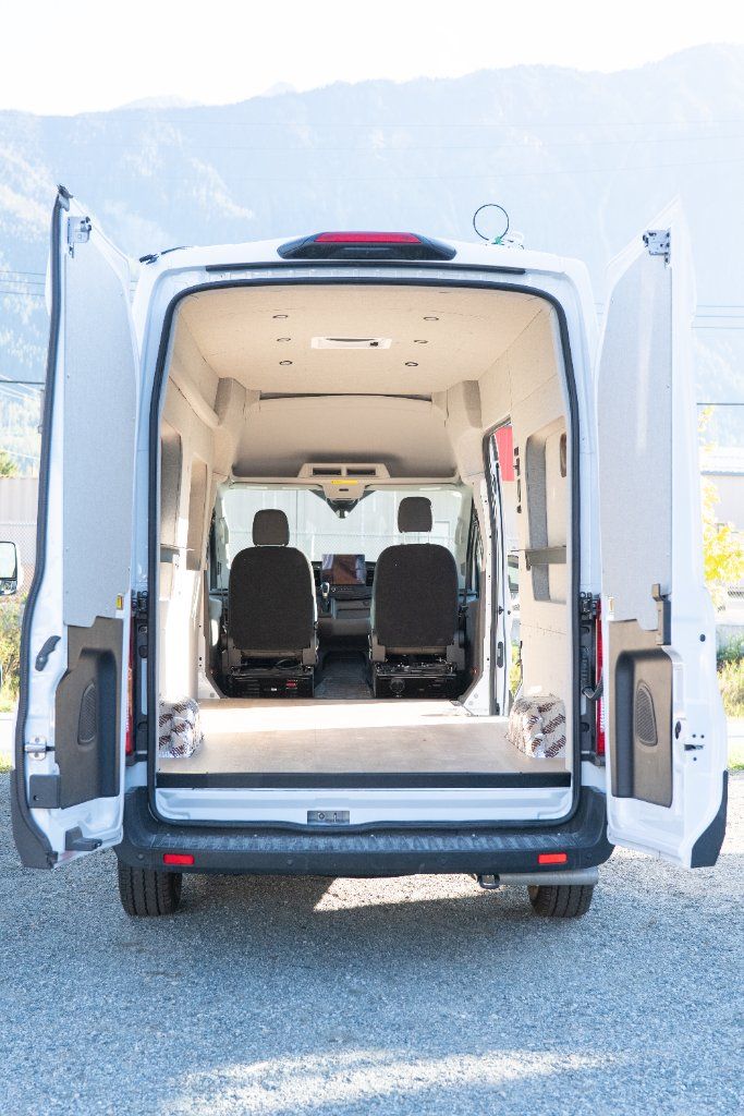 Ford Transit with rear doors open showing the interior build