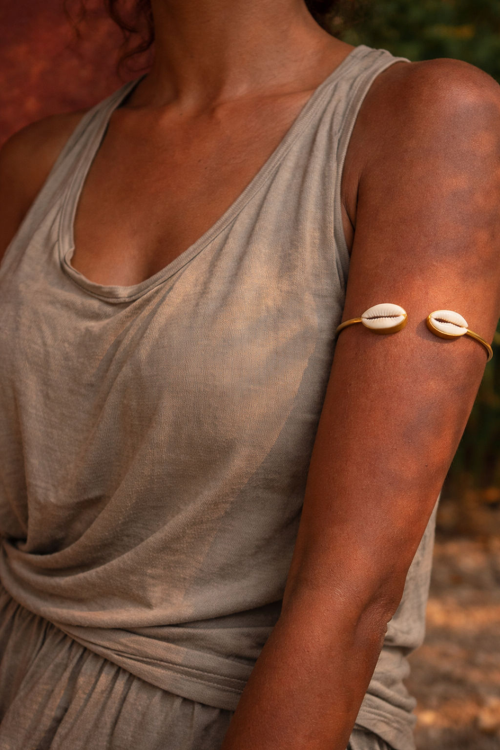 Seaworn — Cord is paired with a natural cowrie shell and finished with raw brass elements., arm — Jhōlâ