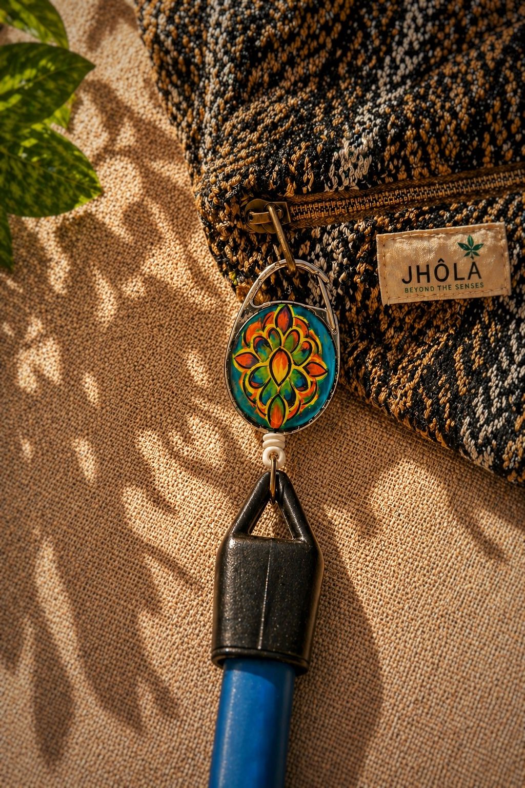 Solara — Hand-painted acrylic plate with UV-reactive pigments, silicone lighter holder, and metal carabiner clip., Lighter Holders — Jhōlâ