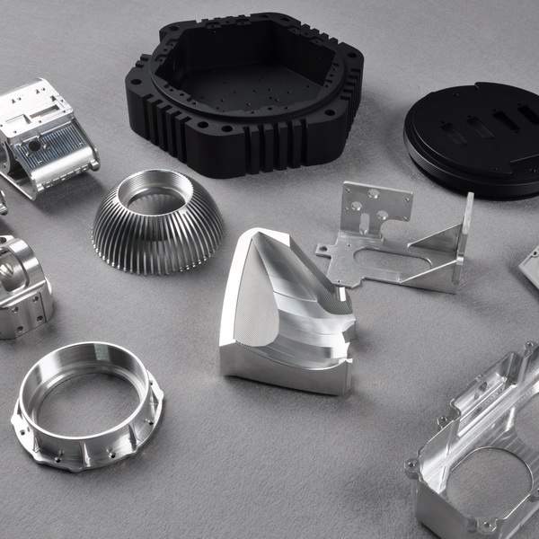 Assorted CNC machined prototypes including housings, rings and fins with various surface finishes