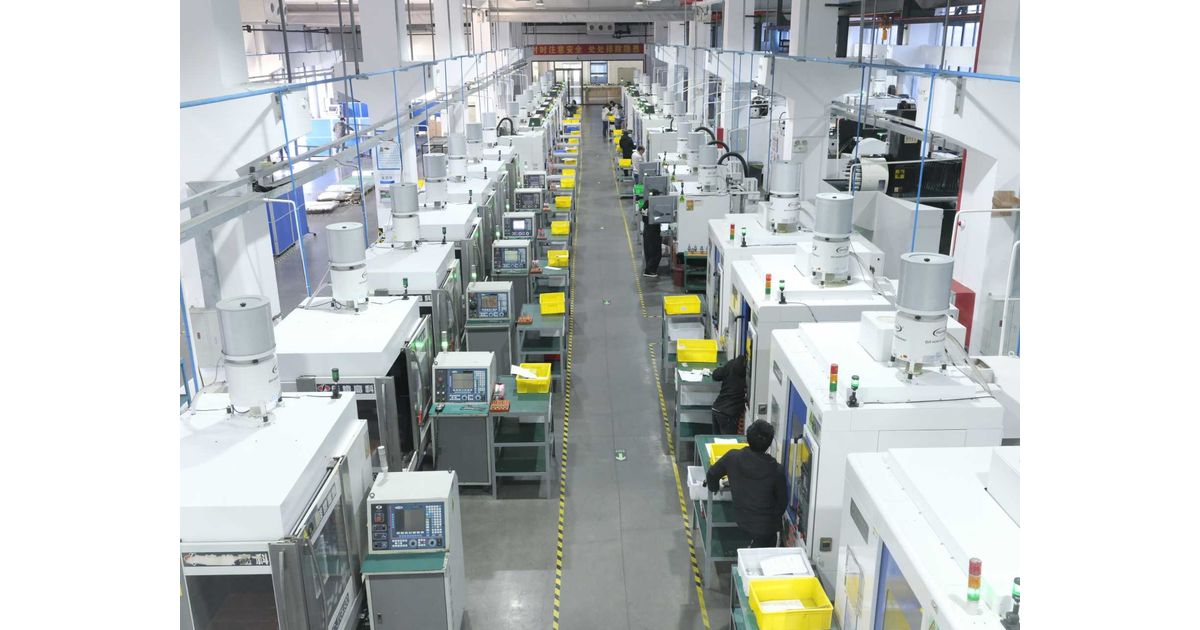 NEXTAS production floor with rows of CNC machining equipment
