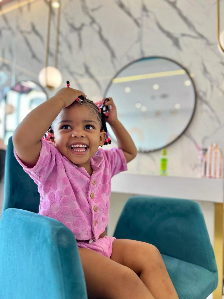  Posing for the camera: Young clients flaunting their fabulous hairstyles at our salon.