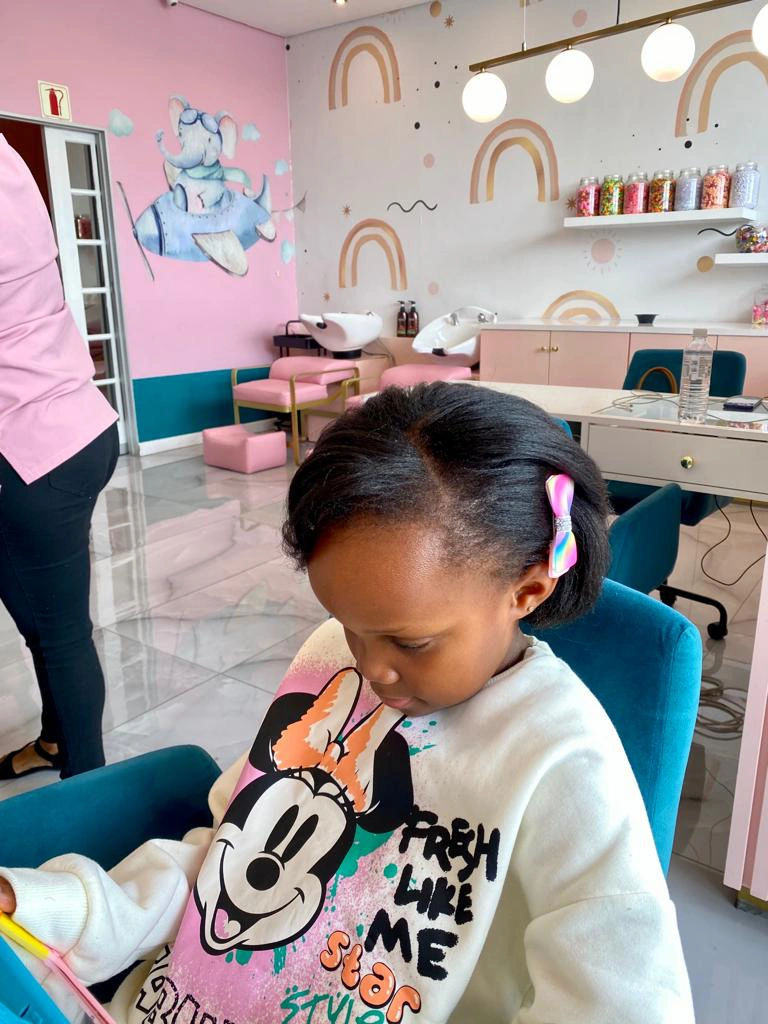  Young girl enjoying a pampering session at POSH ANGELS Luxury Kids Salon