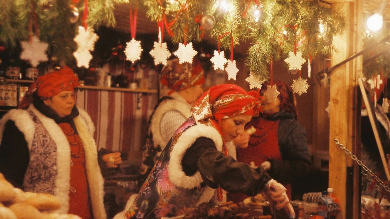 festive holiday decorations and people dressed in Christmas apparel