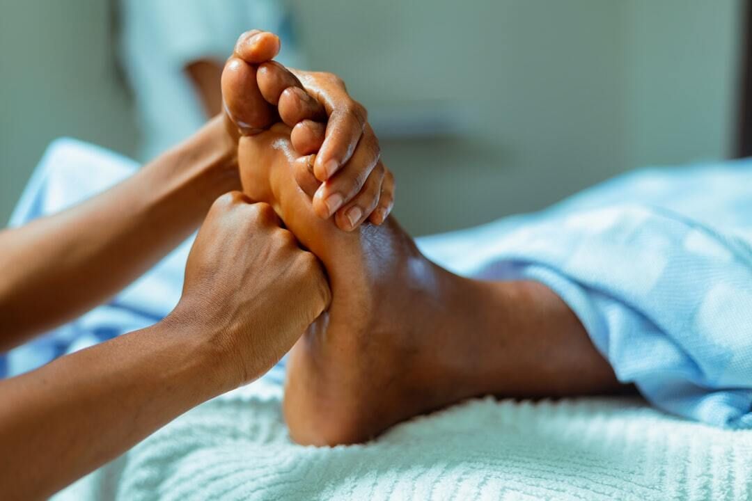 Massage therapist working on a client at a St. Louis spa