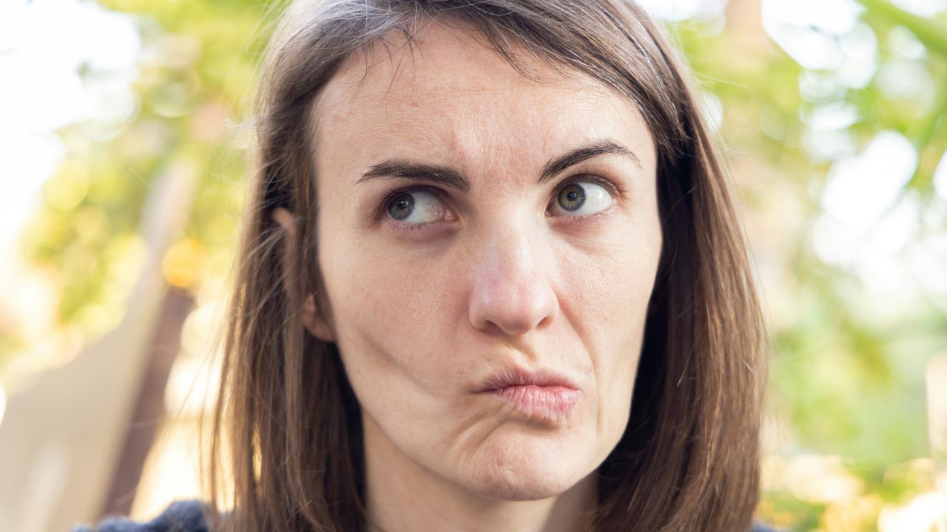 a woman with a disappointed look on her face