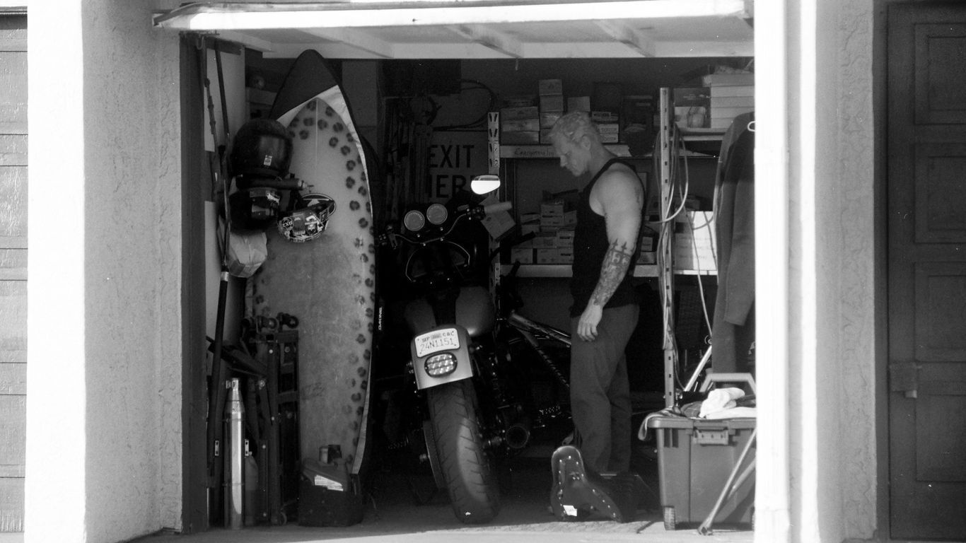 man in garage with overhead door open