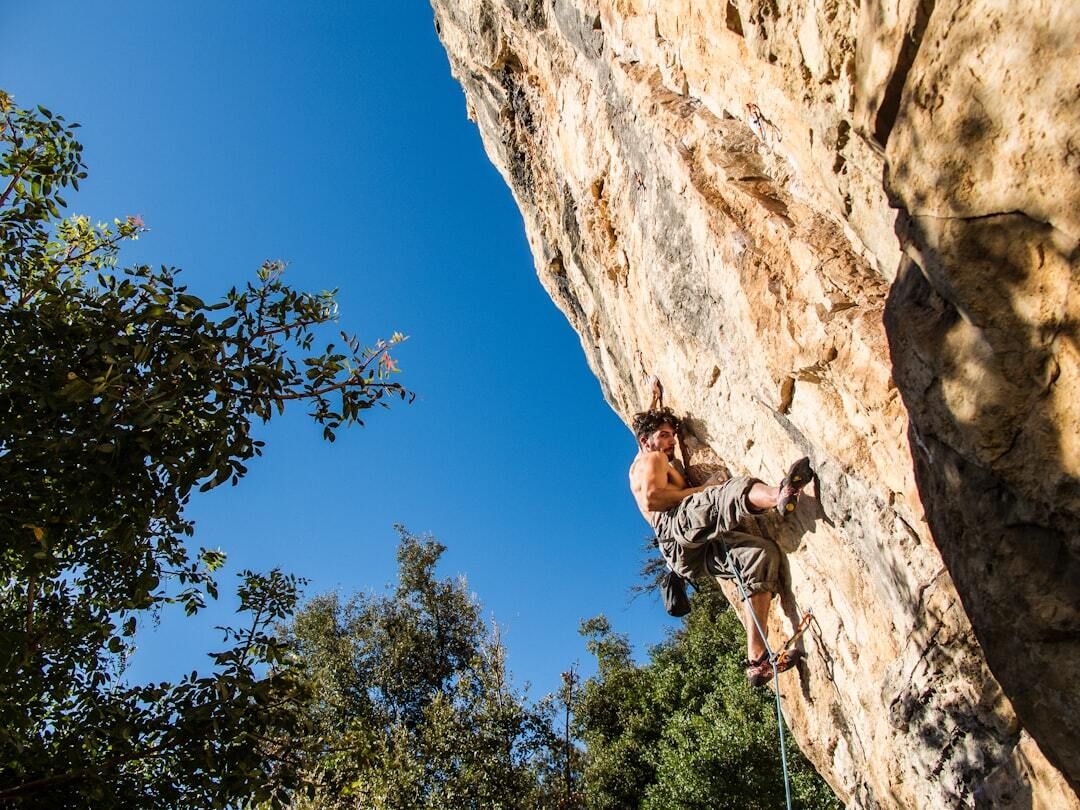 rock climber on a stone face mountain