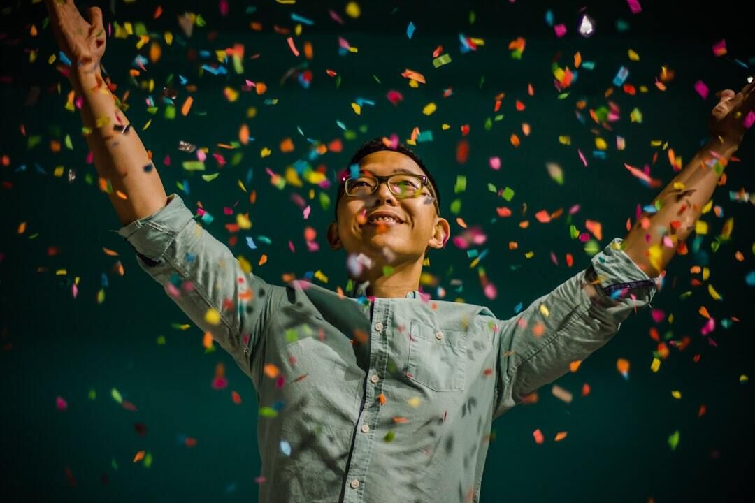 man throwing confetti to celebrate New Years in St Louis Missouri