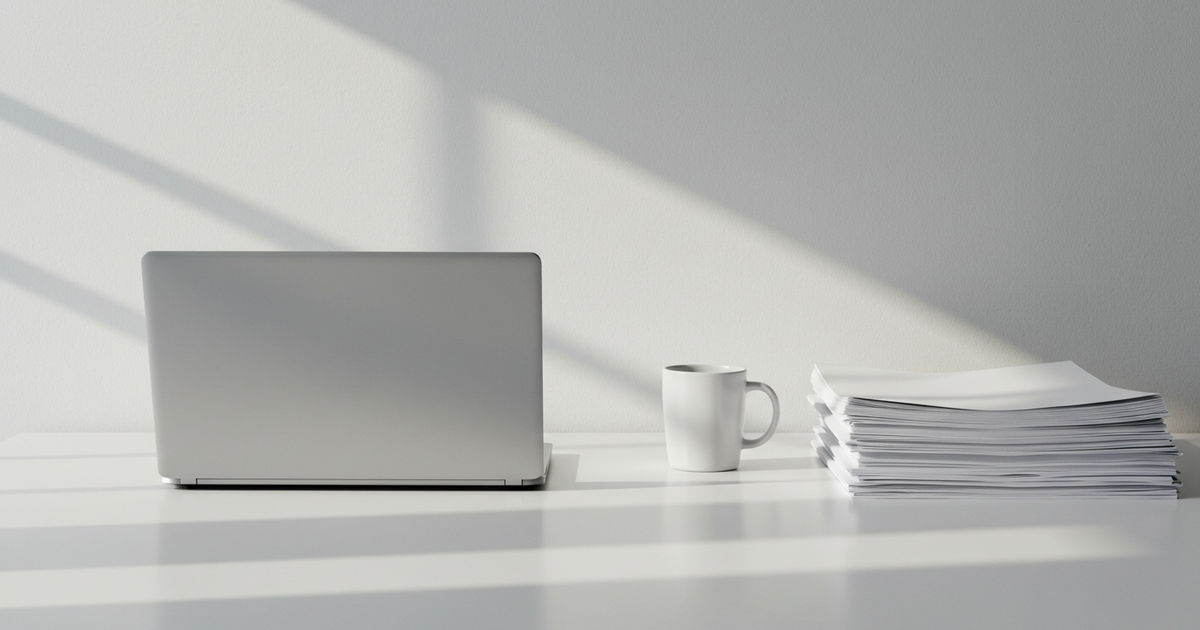 A calculator, pen, and neatly organized folder of papers on a desk &mdash; free tax help in St. Louis