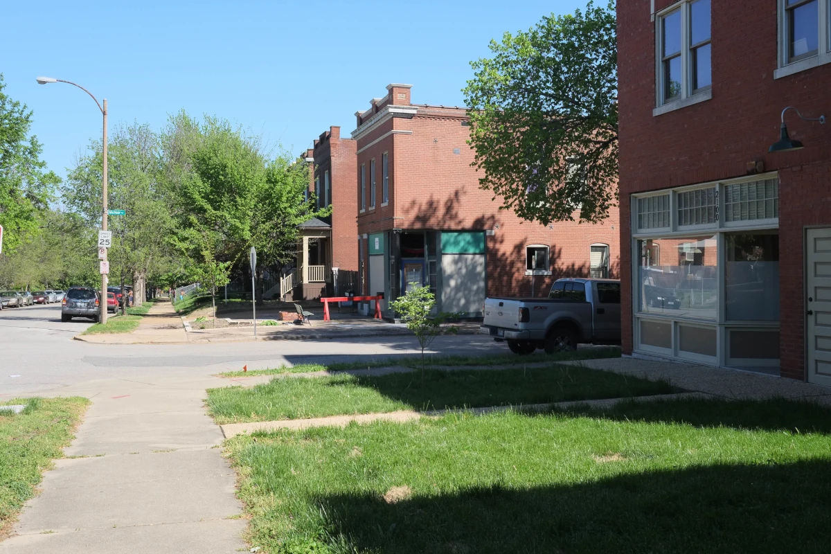 Historic brick homes along a tree-lined street in the McKinley Heights neighborhood of St. Louis