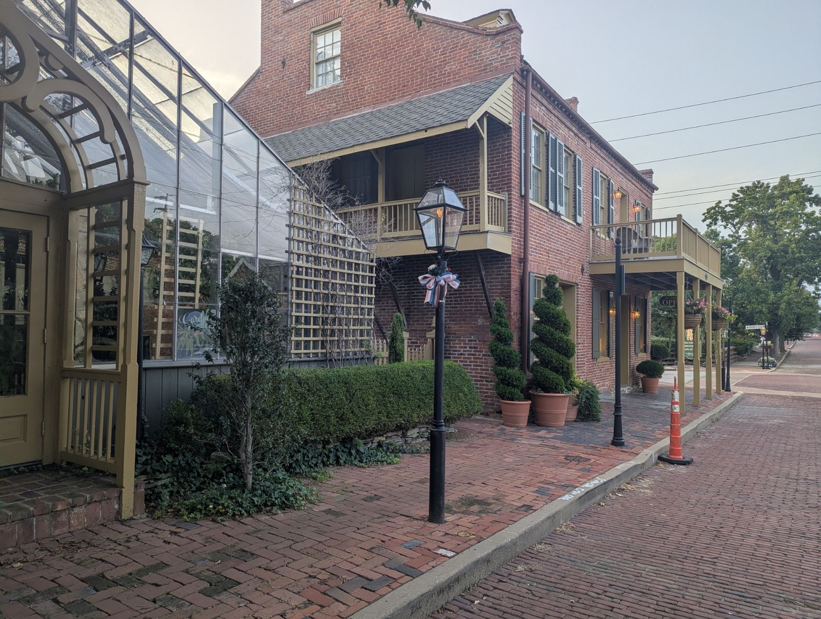 Gas-style street lamp and restored brick storefronts on North Main Street in St. Charles, Missouri