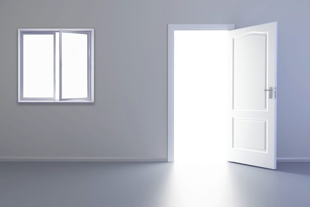 A clean apartment with a window and open door to let the sunshine in