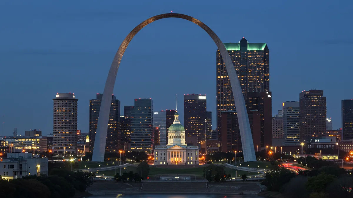 the St. Louis downtown skyline with corporate headquarters buildings at dusk Editorial photograph, natural lighting, realistic, high quality. No text, no words, no letters, no wate