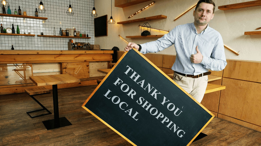 Local business owner thanking customers for shopping local