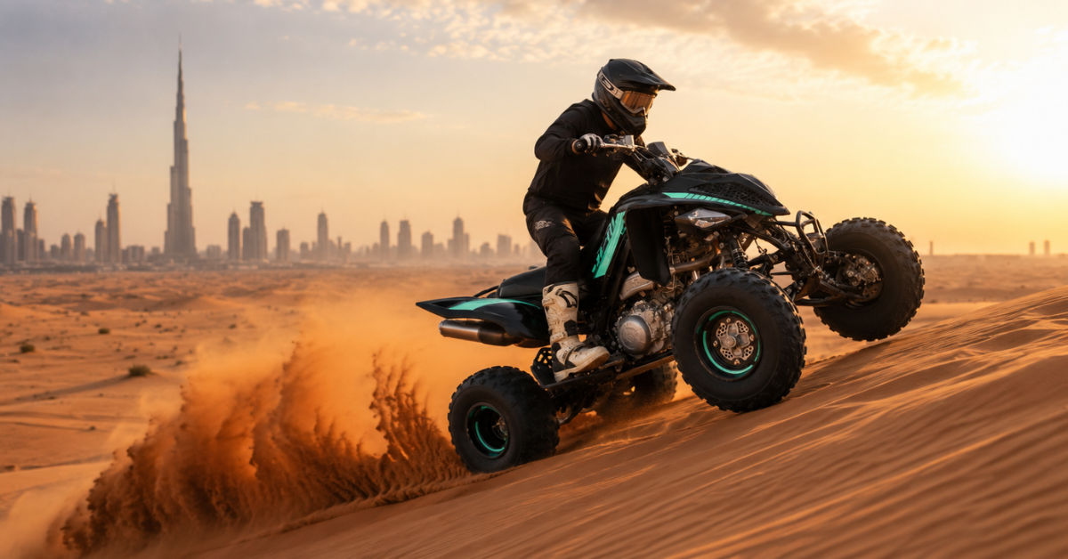 Rider on Yamaha Raptor 700R climbing a Dubai desert dune