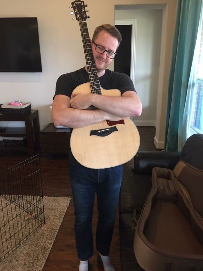 Me hugging my new Gibson guitar, a gift received for my birthday