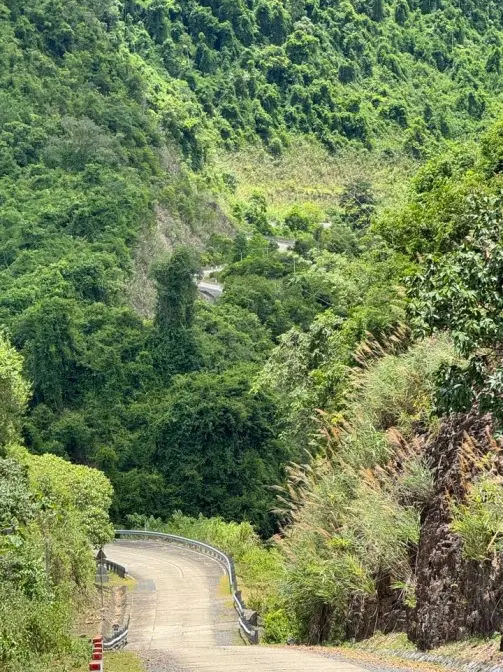the lonely roads, sometimes you ride an hour and you barely see anyone alongteh Ho Chi Minh road in vietnam