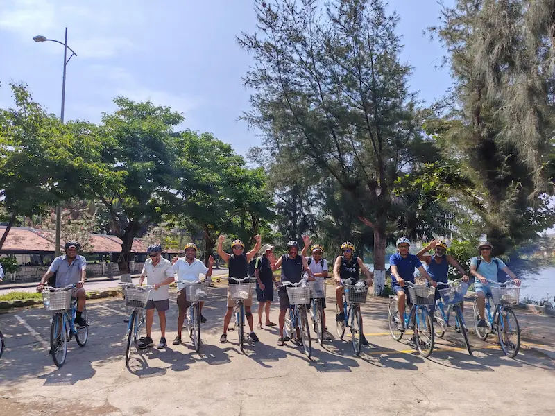 a group of New Zealander tourists cycling around Hoi An - tour arranged by vietnameseprivatetours.com