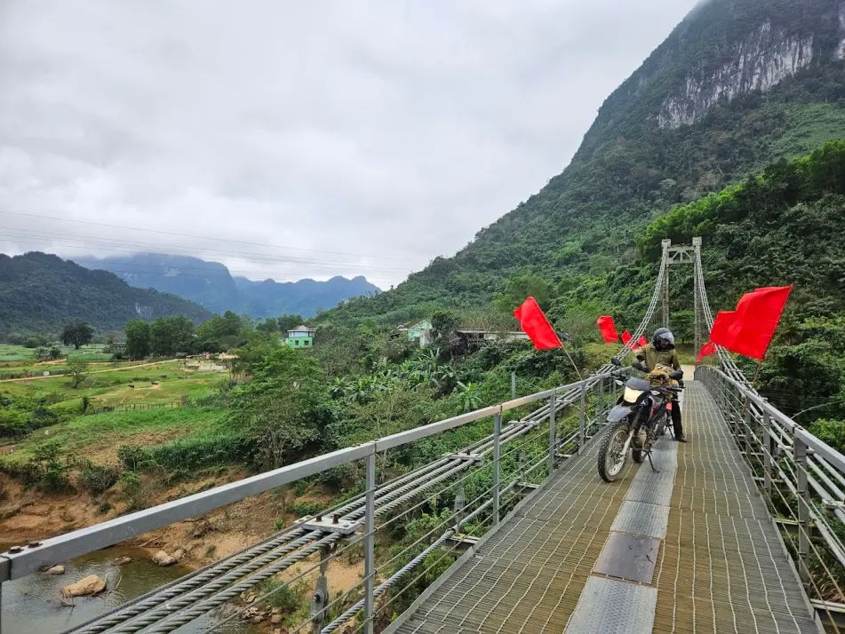 Suspension bridge over the Long Đại River along the Ho Chi Minh trail