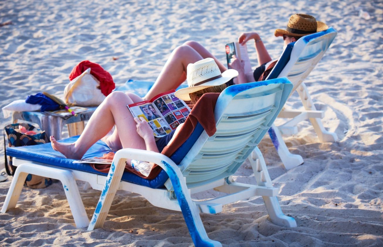tourists on sun chairs in nha trang beach