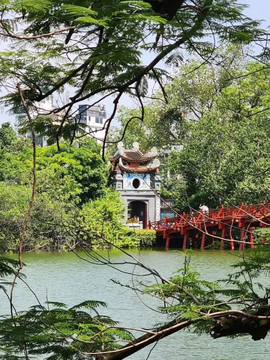 temple entrance from the Hoan Kiem Lake with Hoc Bridge over the lake