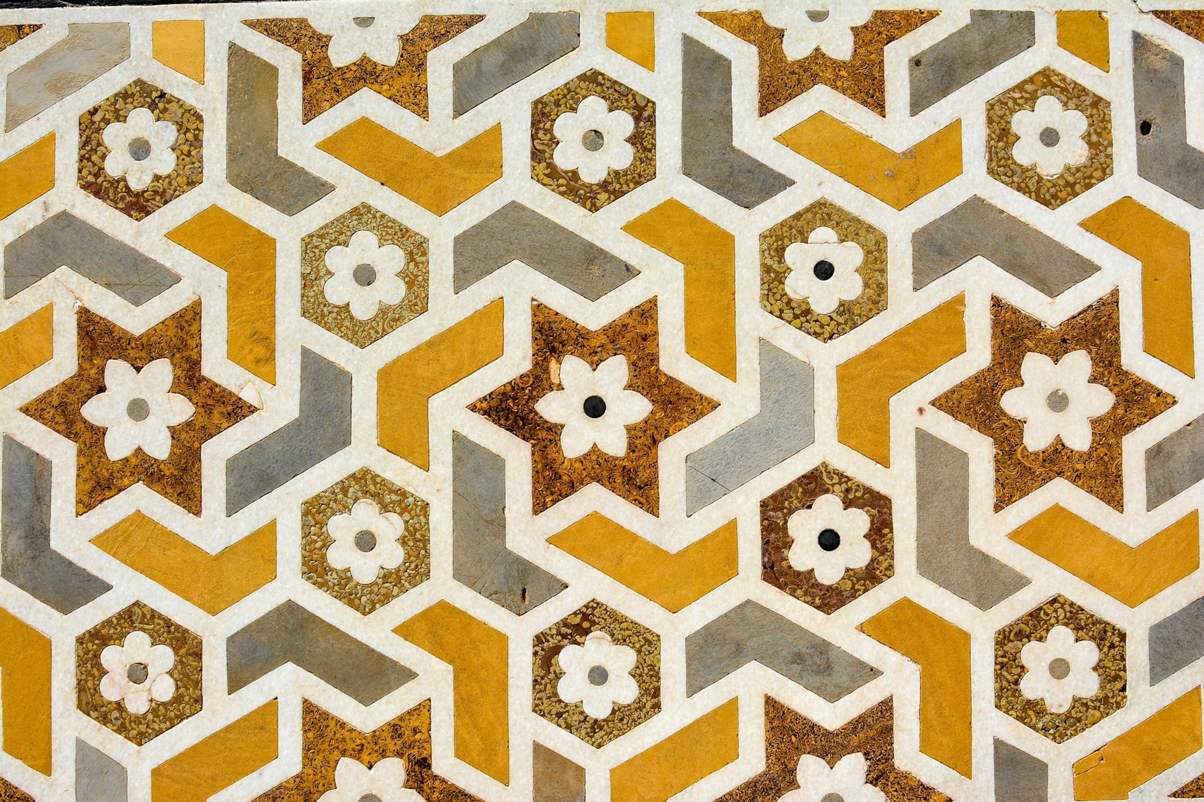 A floral pattern, representing the ordered structures behind Arabic word families.