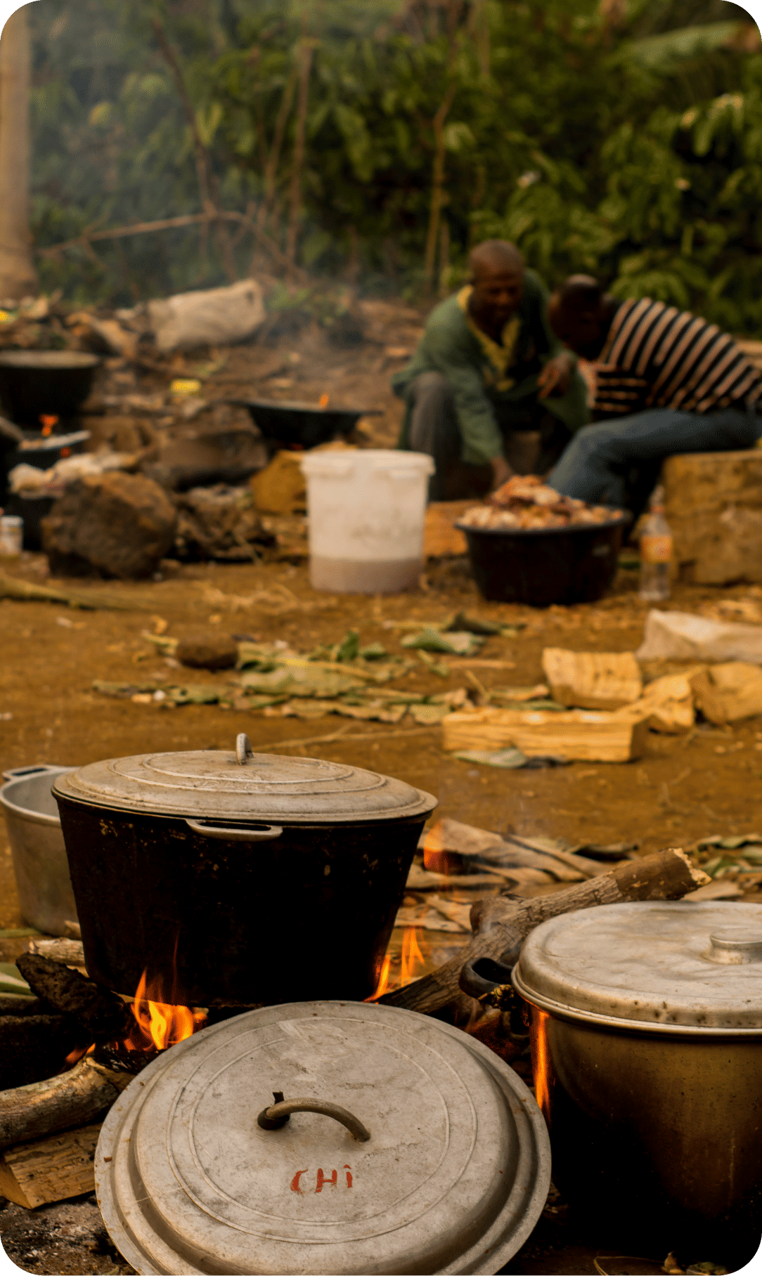 Traditional cooking with clay pots over open fire