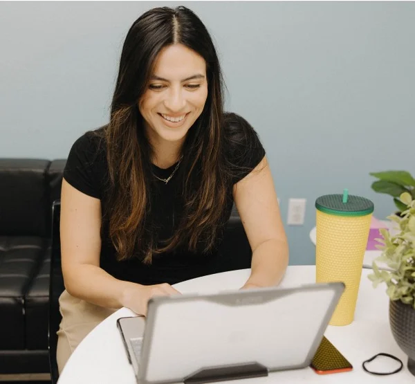 Woman reading faqs on a computer