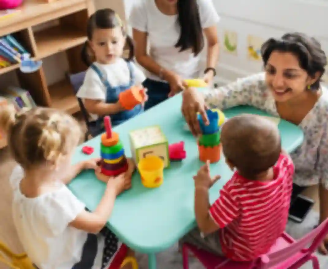 Smiling teacher with kids