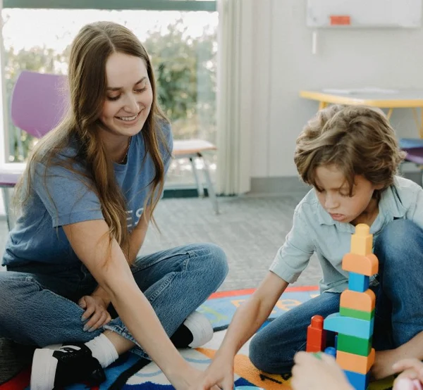 Woman playing with kid