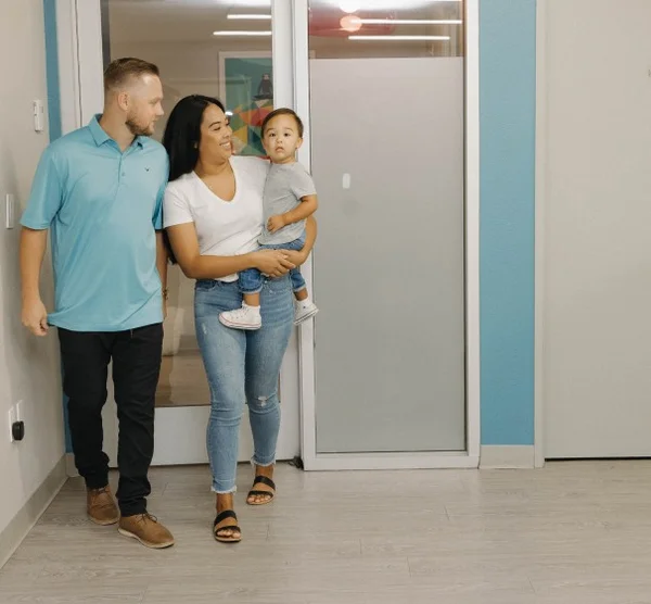 Family holding child