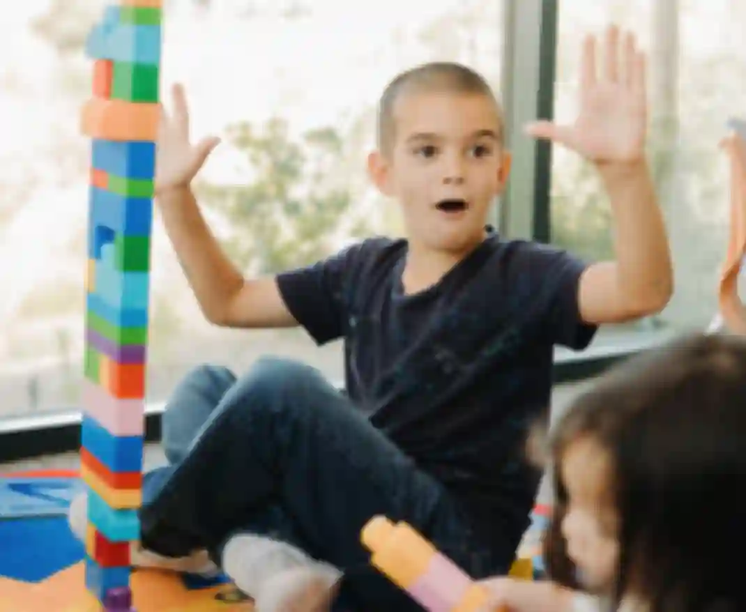 Child proud of block tower