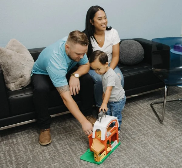 Family playing with son ABA therapy