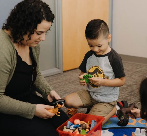 Teacher with child using ABA therapy