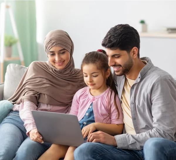 Arabic family sitting at computer