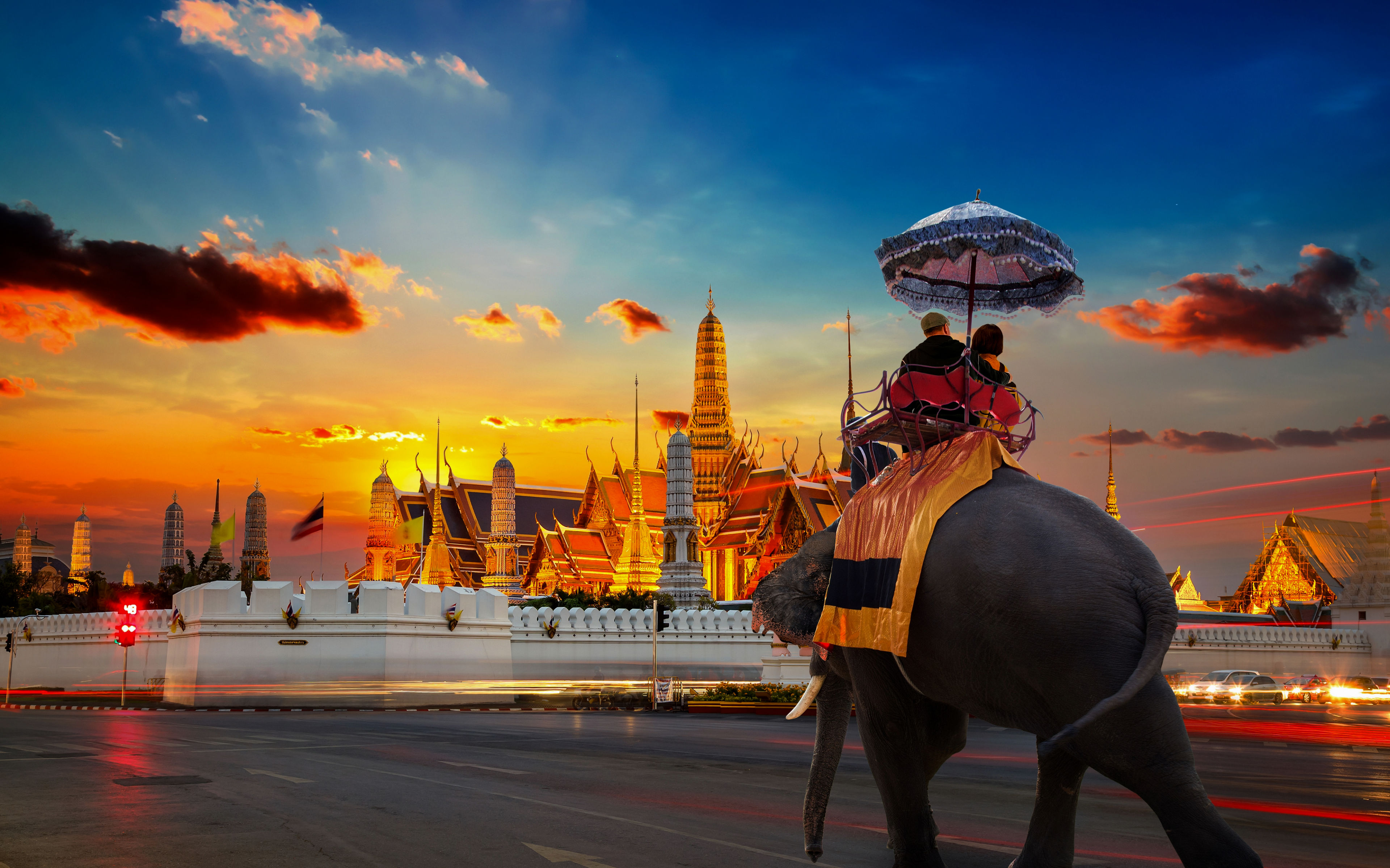 Ornate spires and golden roofs of the Grand Palace temple complex in Bangkok, Thailand