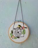 photographer hoop wall hanging. hand crafted, hand embroidered