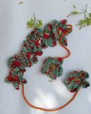 Handcrafted floral gajra adorned with colorful artificial flowers.