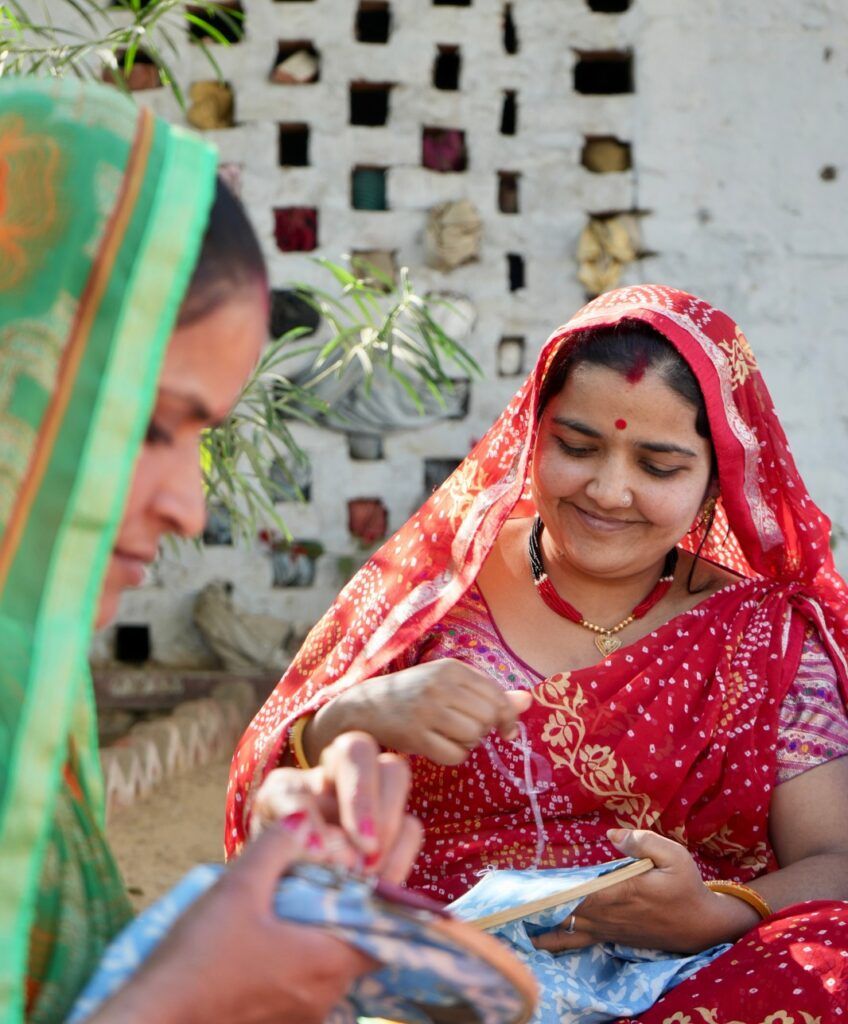 Mysa artisans working on textile embroidery
