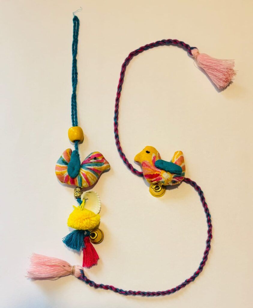 Colourful textile bird loomba and hand rakhi with tassels