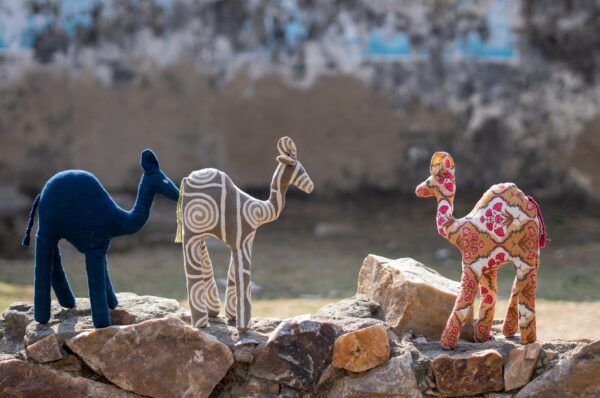 Small handmade stuffed camel toys.