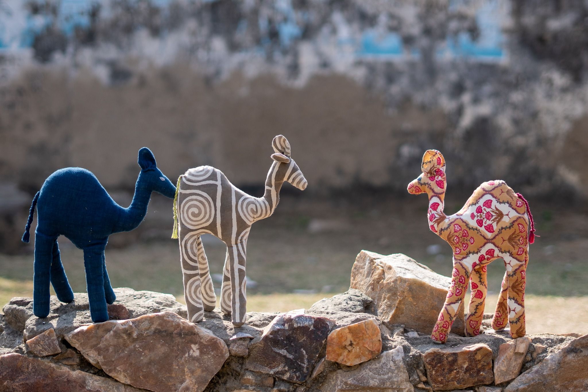 Small handmade stuffed camel toys.